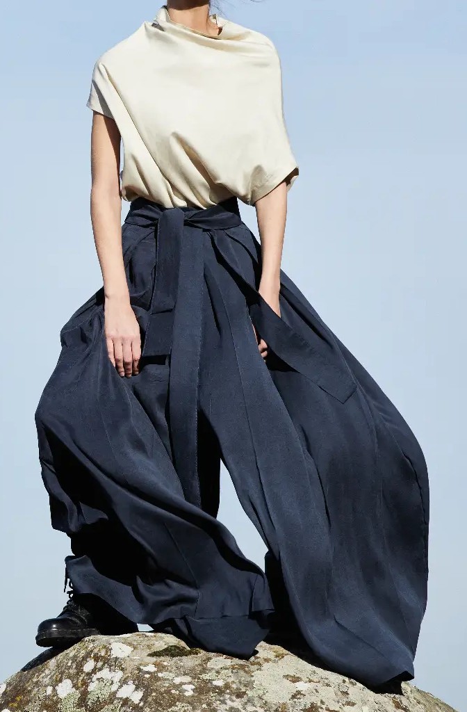 Hakama Trousers/Silk, on a rock facing the camera — one leg open