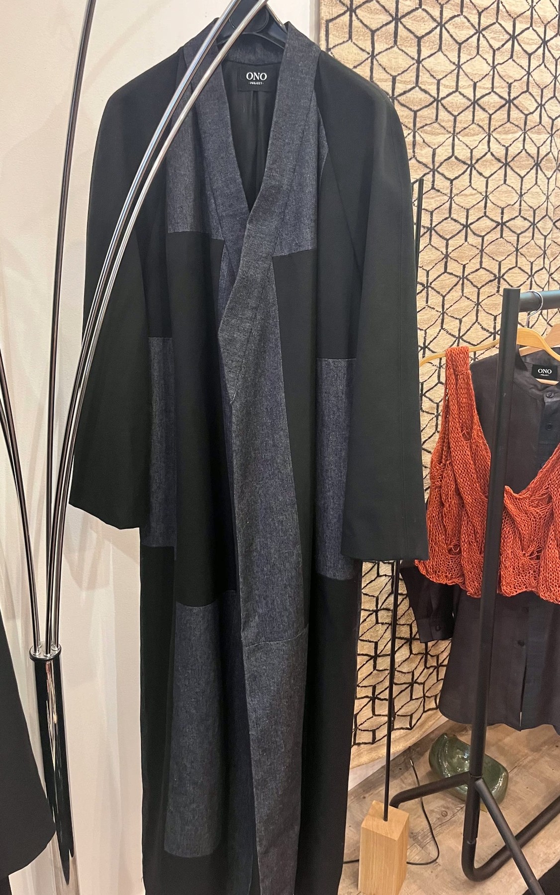 Em Coat on a hanger in the shop