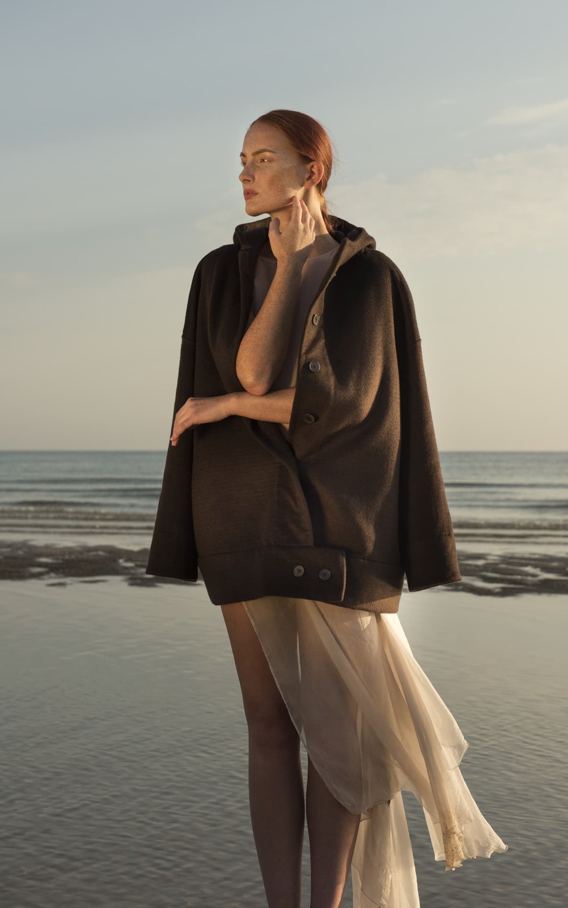 Naga Coat, worn on the beach
