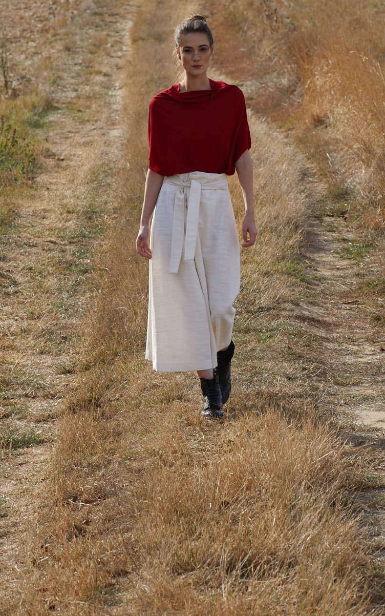 Naga Top in red, walking in a field